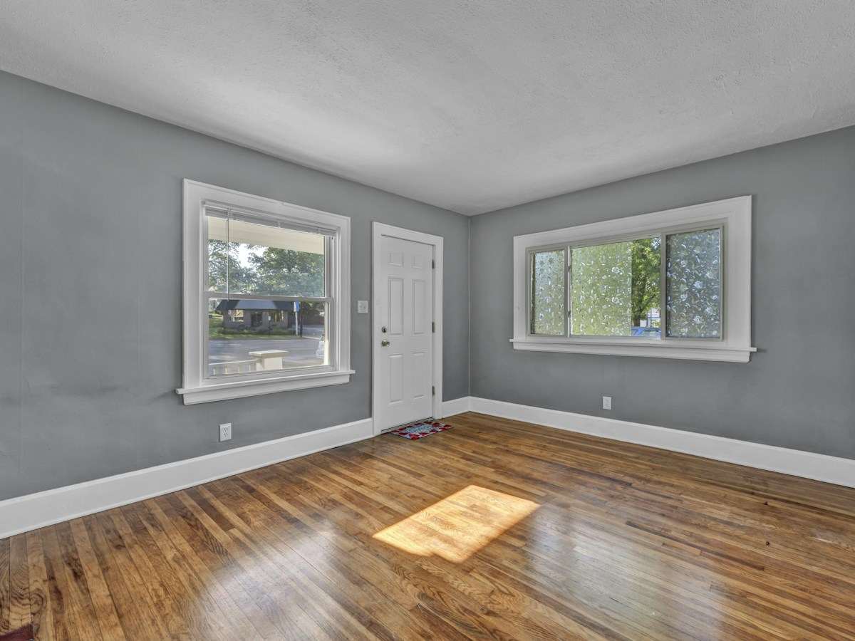 Freshly painted gray room with white trim