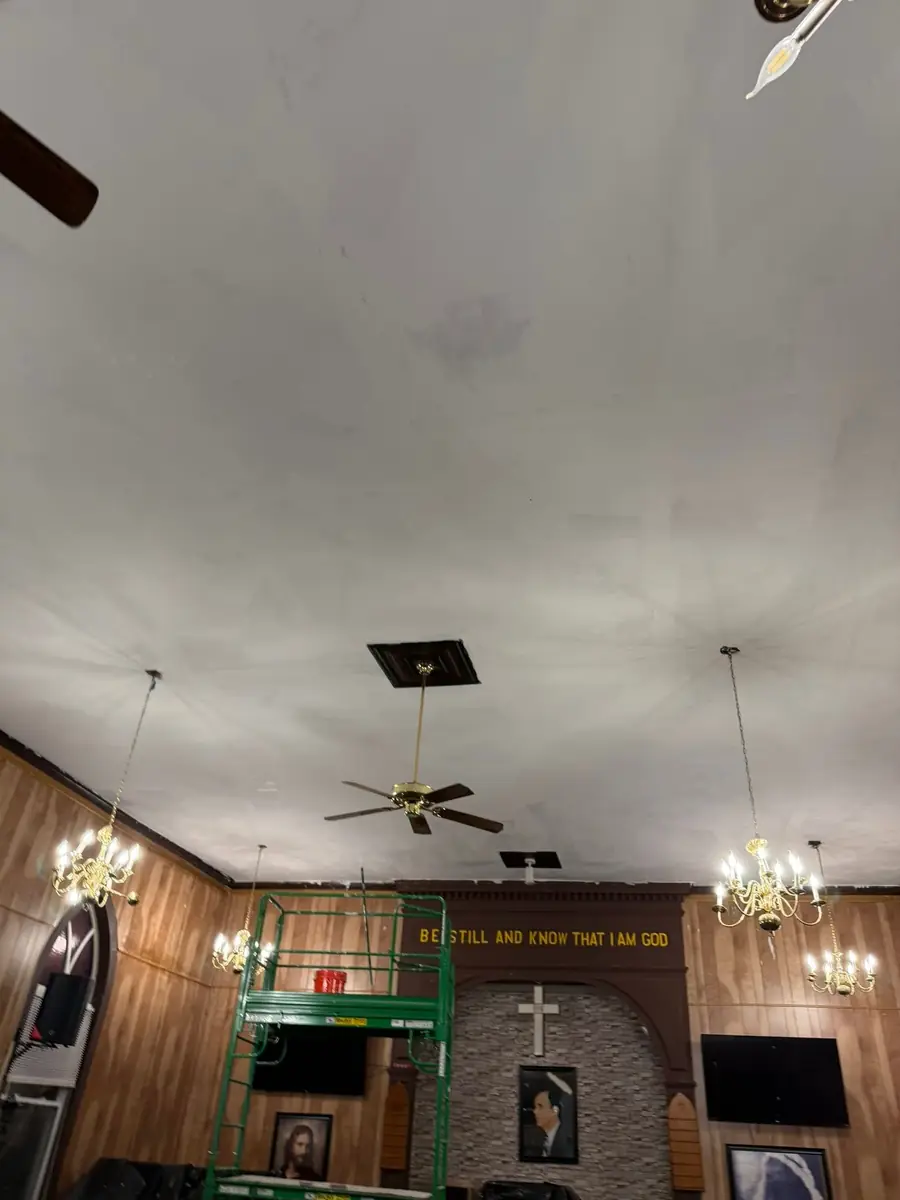 New ceiling panels in place, with scaffolding in the church